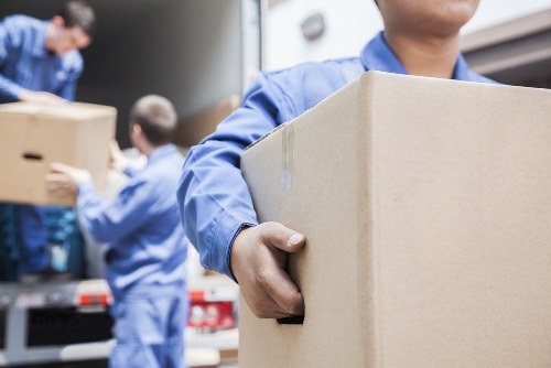 Moving boxes and furniture prepared for house removals in Mertonpark
