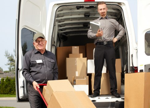 Moving van and packed boxes outside a Mertonpark flat