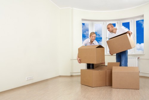 Professional removal team loading furniture in Mertonpark