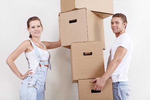 House removal team handling furniture in Mertonpark